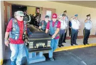  ??  ?? Motorcycli­sts from VFW Post 4287 and American Legion Post 155 present the casket of Spicer during the service at Woodlawn Memorial Park.