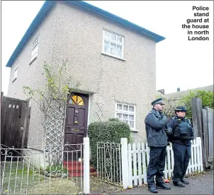  ??  ?? Police stand guard at the house in north London