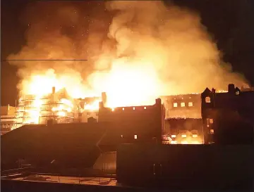  ??  ?? The rear elevation of the Glasgow School of Art is seen on fire, in Glasgow, Scotland, Britain in this still image obtained from social media.—