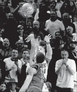  ?? Steve Dykes Getty Images ?? DAMIAN LILLARD of the Trail Blazers hits the Game 5 winner, from deep in three-point range, over Paul George to beat the Thunder and end their series.