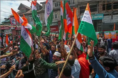  ?? ?? Supporters of Bharatiya Janata Party (BJP) raise slogans during the Tiranga Bikers rally near Clock Tower, Lal Chowk on Monday. KO Photo Abid Bhat.