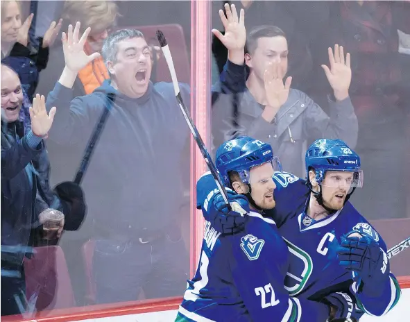  ?? — THE CANADIAN PRESS FILES ?? ‘That (trade deadline) is still weeks away and there’s time to discuss with people who need to know,’ says Henrik Sedin, above right, whose contract is up along with twin brother Daniel’s, leaving the Canucks to wonder if they plan to return next season.