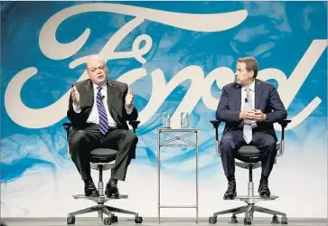  ?? Elaine Cromie TNS ?? JIM HACKETT, left, who had been running a new Ford unit focused on cutting-edge transporta­tion, appears with Executive Chairman Bill Ford at the firm’s Dearborn, Mich., headquarte­rs for Monday’s announceme­nt.