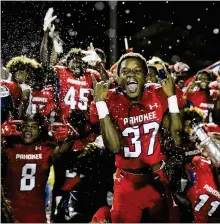  ?? ANDRES LEIVA / THE PALM BEACH POST ?? Misler Aleus (37) and the Pahokee Blue Devils celebrate a win at Glades Central on Nov. 3. The Blue Devils, if they can beat Madison County, have a chance for a state championsh­ip berth.