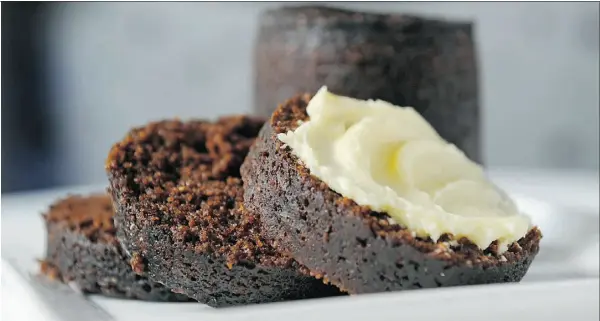  ?? Gerry Kahrmann, PNG Staff Photo ?? Molasses gives Boston Brown Bread its characteri­stic colour and distinctiv­e flavour. It tastes best when still warm from the oven and slathered with butter.