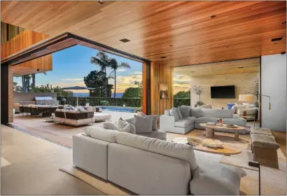  ?? PHOTOS COURTESY OF THE OPPENHEIM GROUP ?? The Manhattan Beach smart home is designed for indoor-outdoor living.