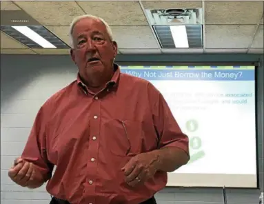  ?? OSCAR GAMBLE — DIGITAL FIRST MEDIA ?? Plymouth Township Council Chairman Marty Higgins discusses capital improvemen­ts needed to repair the township’s police station and administra­tive building at an open house at the Greater Plymouth Community Center, Wednesday, May 23, 2018.
