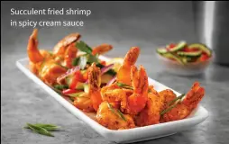  ??  ?? Succulent fried shrimp in spicy cream sauce