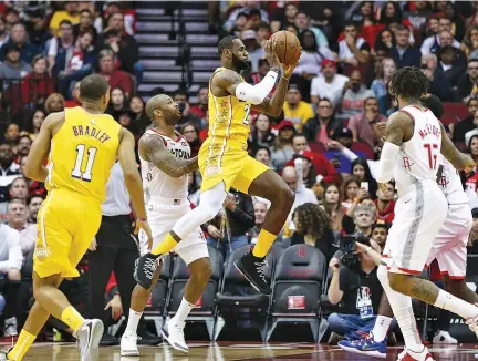  ?? TROY TAORMINA-USA TODAY SPORTS ?? LOS ANGELES Lakers forward LeBron James looks to pass the ball to an open teammate during the first quarter against the Houston Rockets at Toyota Center.