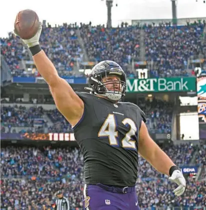  ?? KENNETH K. LAM/STAFF ?? The Ravens’ Patrick Ricard celebrates his touchdown against the Dolphins in the fourth quarter Sunday. The Ravens defeated the Dolphins, 5619, at M&T Bank Stadium.