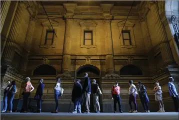  ?? MATT ROURKE — THE ASSOCIATED PRESS ?? Voters wait in line to make correction­s to their ballots for the midterm elections at City Hall in Philadelph­ia.