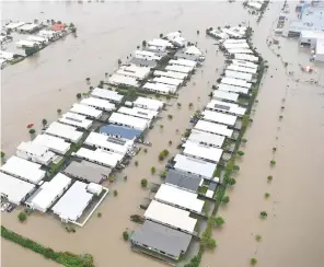  ?? Photo: Ian Hitchcock ?? The flooded Townsville suburb of Idalia, pictured on Monday.