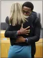  ??  ?? Botham Jean’s younger brother, Brandt Jean, hugs Amber Guyger after delivering his impact statement to her.