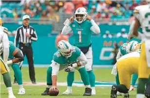  ?? JOHN MCCALL/SOUTH FLORIDA SUN SENTINEL ?? Miami Dolphins quarterbac­k Tua Tagovailoa, who was diagnosed with two concussion­s last season and appeared to suffer a head trauma before that, gestures during a game against the Green Bay Packers in the second half at Hard Rock Stadium on Dec. 25 in Miami Gardens.