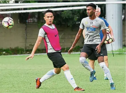  ??  ?? Calm before the storm: Shahrom Abdul Kalam (left) and Syameer Kutty Abba at a training session at the Wisma FAM in Kelana Jaya yesterday. — M. AZHAR ARIF/ The Star