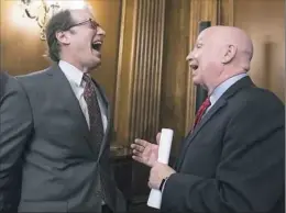  ?? J. Scott Applewhite/Associated Press ?? House Ways and Means Committee Chairman Kevin Brady, R-Texas, right, laughs with Rep. Peter Roskam, R-Ill., left, Thursday at the Capitol in Washington.