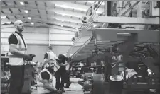  ?? PROVIDED TO CHINA DAILY ?? CIMC Vehicles (Group) Co employees put finishing touches to a tractor trailer on its assembly line in the US.