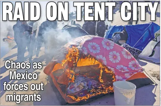  ?? ?? UP IN FLAMES: A tent burns Sunday as Mexican cops try to clear out a Juarez tent city of Venezuelan migrants gathered in hopes of crossing into the US.