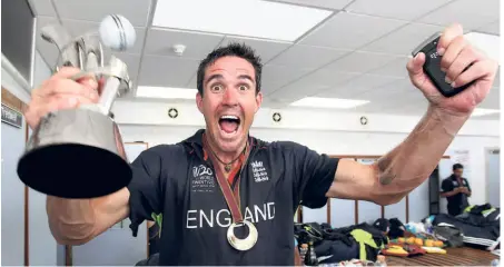  ?? GETTY IMAGES ?? Unbridled joy: England’s Kevin Pietersen celebrates with his Player of the Tournament award in the dressing room after his team’s victory against Australia in the final of the ICC World Twenty20 in Bridgetown, Barbados.