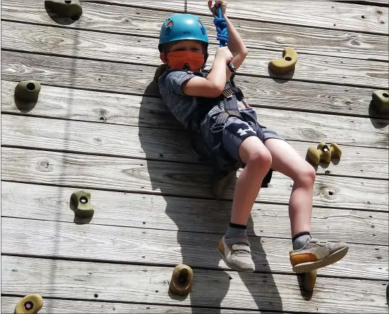  ?? MICHELLE N. LYNCH— MEDIANEWS GROUP ?? Nolan McCreedy, 6, of Lower Alsace Township works his way down a rock climbing wall Sunday at South Mountain YMCA Camp’s Family Fun Day.
