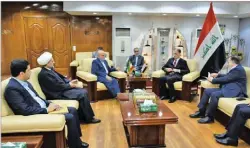  ??  ?? IRNA Iranian Ambassador to Baghdad Iraj Masjedi (3rd left) meets Iraqi Culture and Tourism Minister Abdul Amir al-hamdani (3rd right) in Baghdad on March 7, 2019.