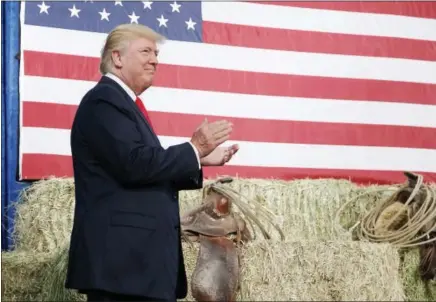  ?? EVAN VUCCI — THE ASSOCIATED PRESS ?? Republican presidenti­al candidate Donald Trump arrives at a campaign rally in Golden, Colo., on Saturday. Trump spent much of his time criticizin­g Democratic opponent Hillary Clinton over her renewed email scandal.