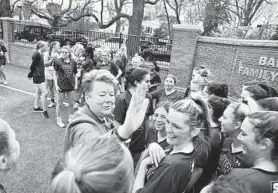  ?? TERRANCE WILLIAMS/FOR BALTIMORE SUN MEDIA ?? Retiring Penn State athletic director and Severn alum Sandy Barbour greets current members of Severn’s girls lacrosse team during a field dedication in her family’s honor Friday during
Severn’s game against John Carroll.