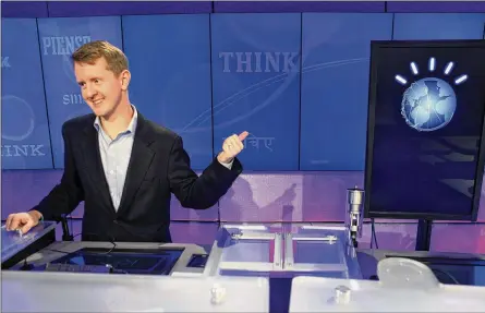  ?? SETH WENIG / ASSOCIATED PRESS 2011 ?? “Jeopardy!” contestant Ken Jennings, who won a record 74 consecutiv­e games, points to his opponent, an IBM computer called “Watson,” after a practice round of the quiz show in January 2011. Seven years after Watson beat Jennings and another “Jeopardy!”...