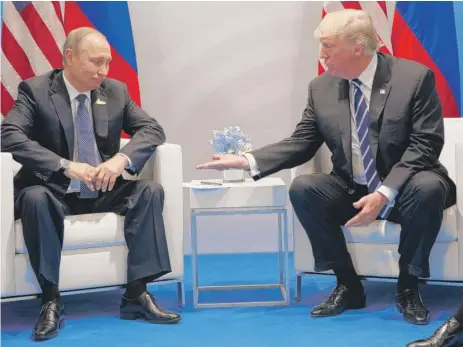  ??  ?? President Donald Trump meets with Russian President Vladimir Putin at the G20 Summit on Friday in Hamburg.