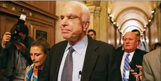  ?? JUSTIN SULLIVAN / GETTY IMAGES; CLIFF OWEN / AP ?? Sen. John McCain, R-Ariz., leaves the Senate chamber at the U.S. Capitol after voting against the GOP “Skinny Repeal” health care bill Friday. The other Senate Republican­s who voted no to block a stripped-down version of Obamacare reform were Sen....