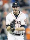  ?? Bob Levey Getty Images ?? CHRIS DEVENSKI exults after striking out Danny Espinosa in the ninth inning.