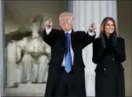  ?? THE ASSOCIATED PRESS ?? President-elect Donald Trump, left, and his wife Melania Trump arrive to the “Make America Great Again Welcome Concert” at the Lincoln Memorial on Thursday in Washington.