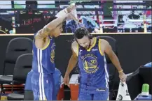  ?? AP photo ?? Stephen Curry has water poured on him by Warriors teammate Juan Toscano-Anderson after scoring 53 points Monday.