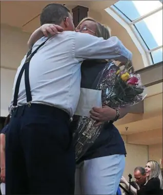  ?? TRACEY READ — THE NEWS-HERALD ?? Charlie Schulz embraces his dance partner Sheryl Kintop April 7 after the dance duo won the 8th annual Deepwood Idol competitio­n at Great Lakes Mall in Mentor.