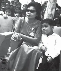  ??  ?? Author Andrew Lam and his mother, who has Alzheimer’s, in her assisted care home in Fremont, California, and a photo of them together in 1968. Lam’s family highlights the rising financial and human costs of aged health care in the US.