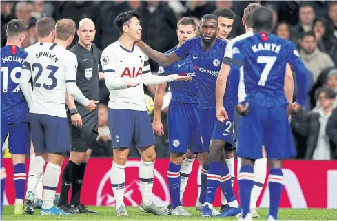  ?? REUTERS ?? Tottenham’s Son Heung-Min, centre left, talks to Chelsea’s Antonio Rudiger after their clash that led to the former being sent off.