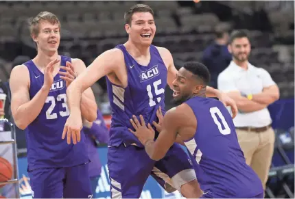  ?? MATT STAMEY/USA TODAY SPORTS ?? Abilene Christian forward Hayden Howell (23) and forward Hayden Farquhar (15) and guard Jaylen Franklin (0) practice Wednesday, a day ahead of the school’s first NCAA basketball tournament game.