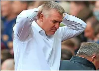  ?? ?? A ToUGh DAY: Dean Smith reacts as his side are relegated by his old club; (below) ings and Mings