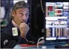  ?? RICHARD DREW — THE ASSOCIATED PRESS ?? Trader John Romolo works on the floor of the New York Stock Exchange on Wednesday, watching as stocks fall sharply.