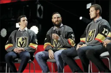  ?? THE ASSOCIATED PRESS ?? Vegas Golden Knights’ Marc-Andre Fleury, Deryk Engelland and Brayden McNabb, from left, sit on stage during an event following the NHL expansion draft on Wednesday night in Las Vegas.