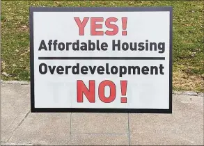  ?? Grace Duffield / Hearst Connecticu­t Media file photo ?? This sign popped up in many front yards around New Canaan, after an applicatio­n for a 102-unit multifamil­y building, with 31 affordable housing units was submitted for Weed Street and Elm Street.