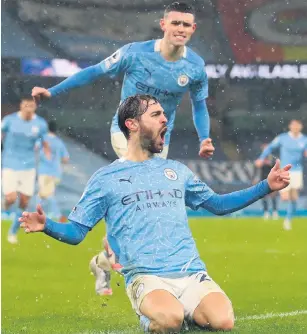  ??  ?? Silva lining: Bernardo Silva of Manchester City celebrates with Phil Foden after opening the scoring against Aston Villa