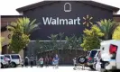  ??  ?? Shoppers wear face masks in the parking lot of a Walmart in Rosemead, California, this month. Photograph: Mario Anzuoni/