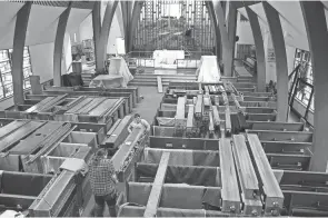  ?? TOM E. PUSKAR/TIMES-GAZETTE.COM ?? The old pipe organ in Trinity Lutheran Church is getting a makeover by the Schantz Organ Co., with some pipes weighing 100 pounds and stretching as long as 16 feet.