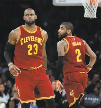  ?? Jae C. Hong / Associated Press ?? Former championsh­ip teammates LeBron James and Kyrie Irving will be on opposite sides when the NBA season opens with James’ Cavaliers facing Irving’s Celtics.