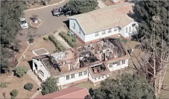  ??  ?? GUTTED BY FIRE:
This aerial picture taken by Steve McCurrach of the burnt-out remains of Cottage 3 at Lakehaven Child and Youth Care Centre, where eight boys died on Thursday, shows how close the buildings are to one another. For more pictures of the...