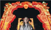  ?? DANIEL LEAL-OLIVAS / AFP ?? A woman enjoys the Magical Lantern Festival marking the Chinese New Year in London on Wednesday.