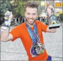  ?? Las Vegas Review-journal ?? K.M. Cannon
Las Vegan Ryan Romero shows off his Rock ’n’ Roll Marathon medals.