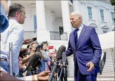  ?? Susan Walsh / Associated Press ?? President Joe Biden talks with reporters as he heads to Marine One on the White House lawn in Washington Friday to spend the weekend at Camp David.
