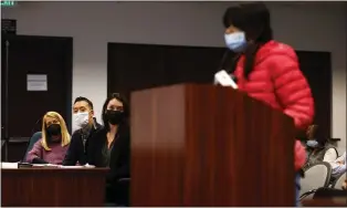  ?? NHAT V. MEYER — STAFF PHOTOGRAPH­ER ?? From left to right, Diane Tavenner, CEO of Summit Denali School, Edward Lee, CFO, and Kate Gottfredso­n, chief of public affairs, listen to Nile Sankaran, 11, a middle schooler, speak to the Santa Clara County Office of Education board regarding the planned closing of Summit Denali School at the board meeting in San Jose on Feb. 15.